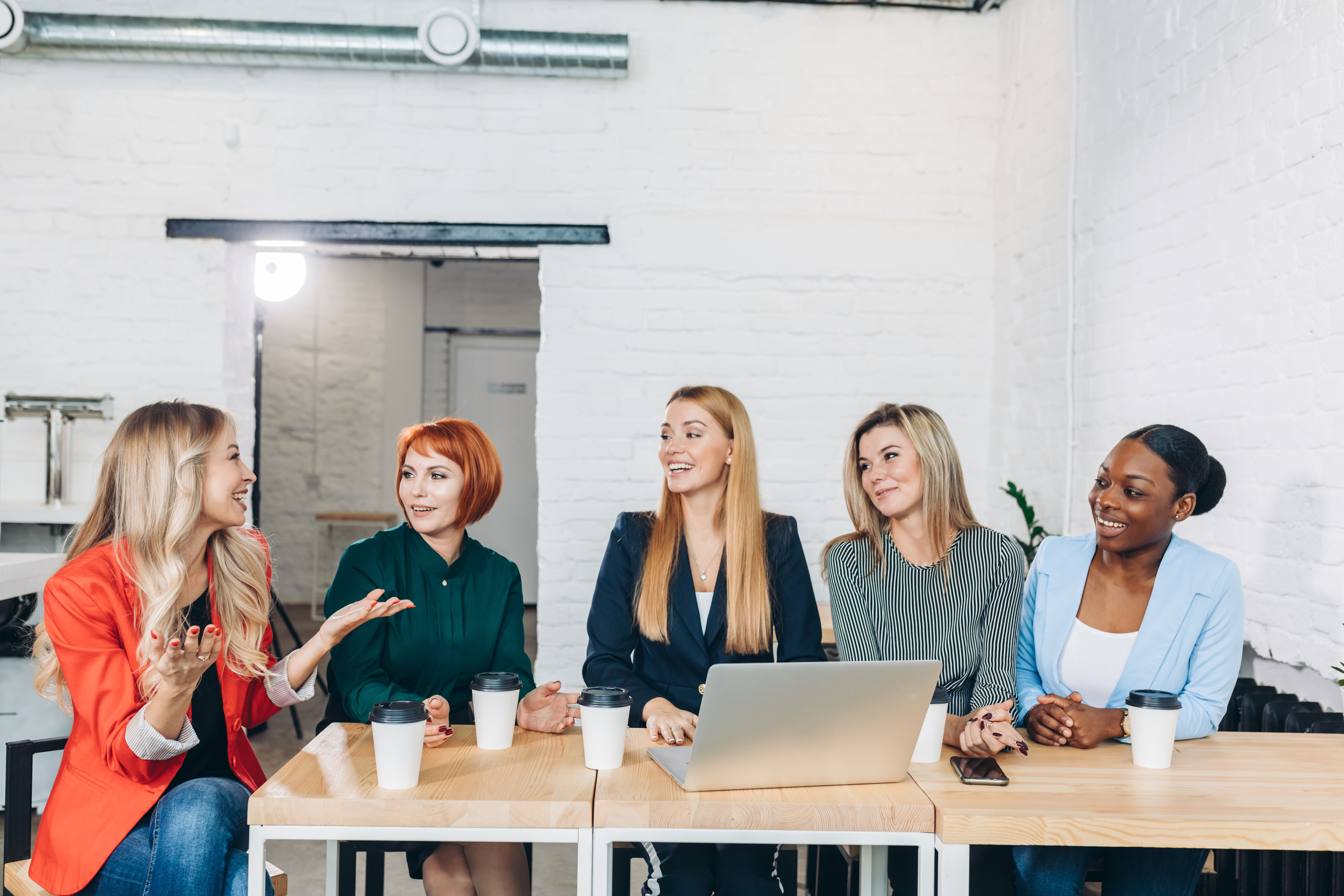 Group meeting in an office, aligned with a New Jersey consulting firm marketing career.